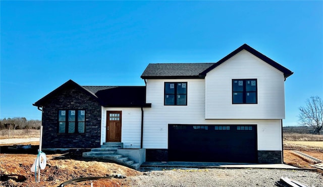 modern farmhouse featuring a garage