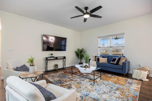 living room with dark hardwood / wood-style floors and ceiling fan