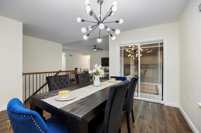 dining space with a notable chandelier and dark hardwood / wood-style flooring