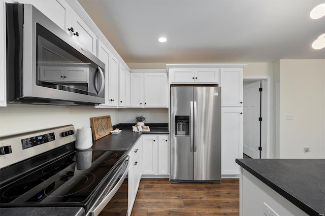 kitchen with white cabinetry, dark hardwood / wood-style flooring, and stainless steel appliances