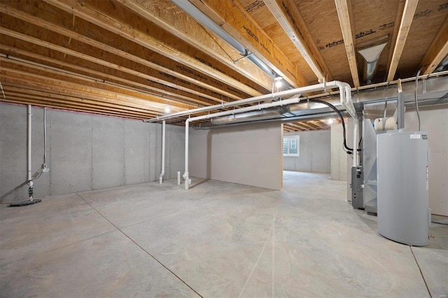 basement featuring electric water heater and heating unit