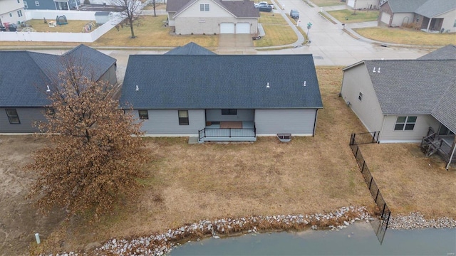 drone / aerial view featuring a water view