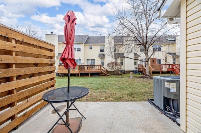 view of patio / terrace with a wooden deck and central AC unit