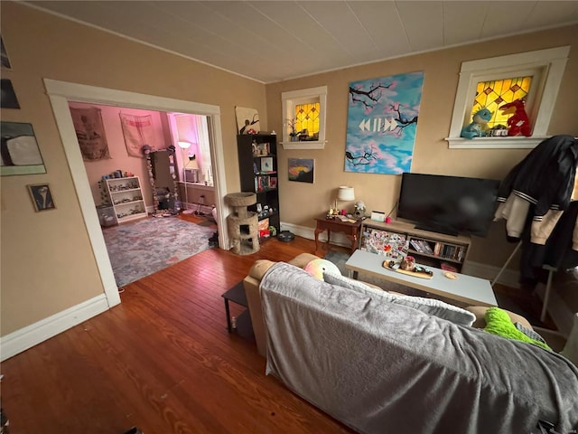 living room featuring baseboards and wood finished floors