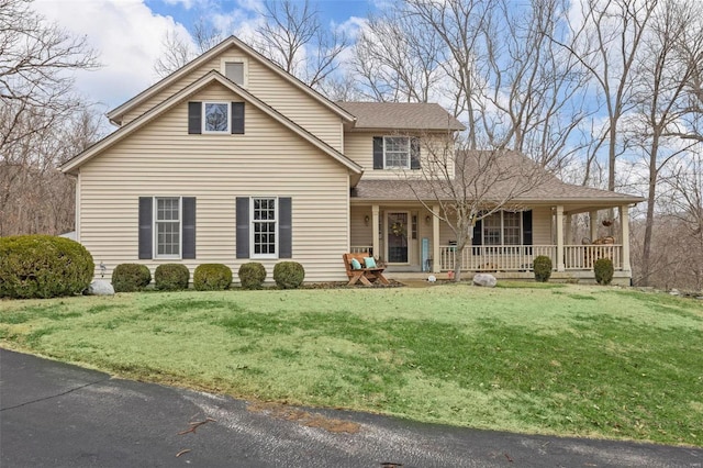 view of front of house featuring a porch and a front lawn