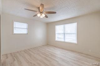 unfurnished room featuring ceiling fan and light hardwood / wood-style floors