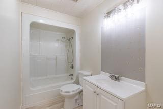 full bathroom with vanity, washtub / shower combination, and toilet