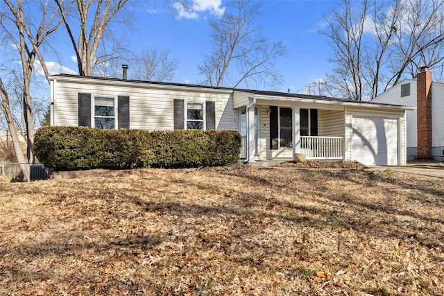 single story home with a garage and covered porch