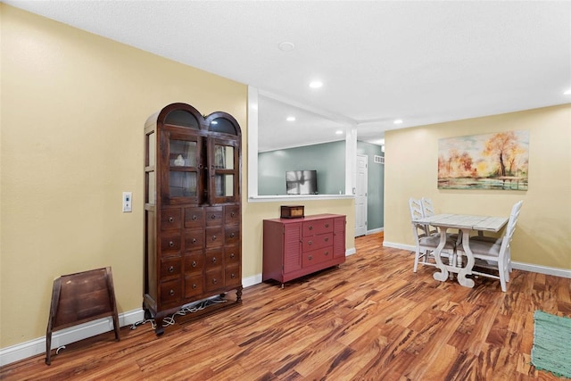 dining room with hardwood / wood-style flooring