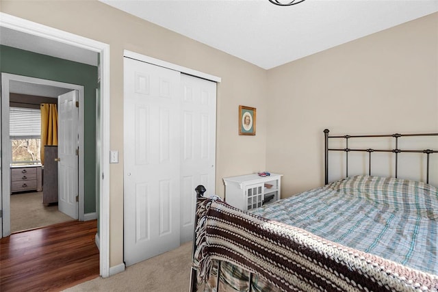 carpeted bedroom with a closet