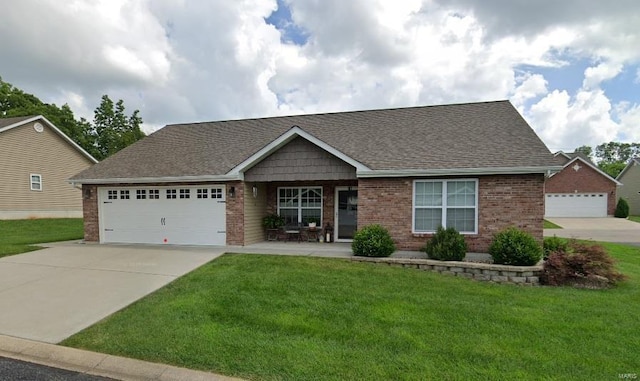 view of front of property with a garage and a front yard