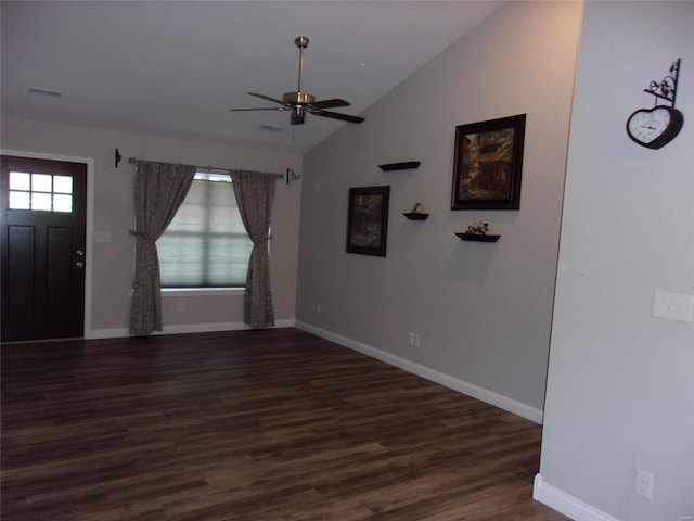 foyer featuring vaulted ceiling, ceiling fan, and dark hardwood / wood-style flooring