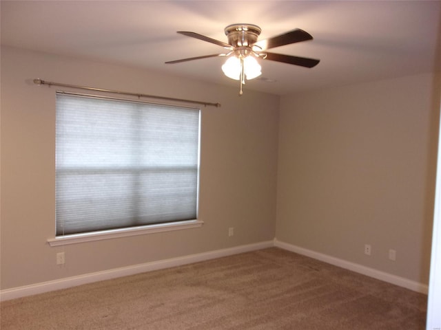 spare room with ceiling fan and carpet floors