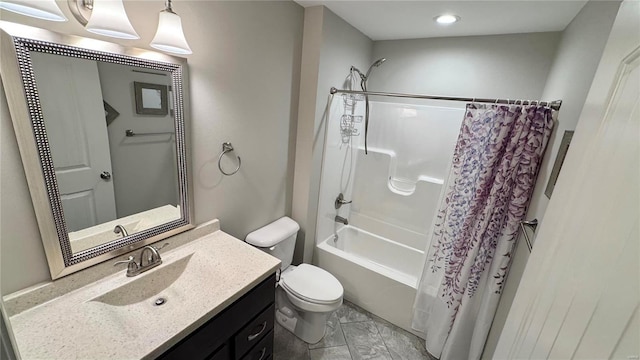 full bathroom with vanity, shower / bath combination with curtain, and toilet