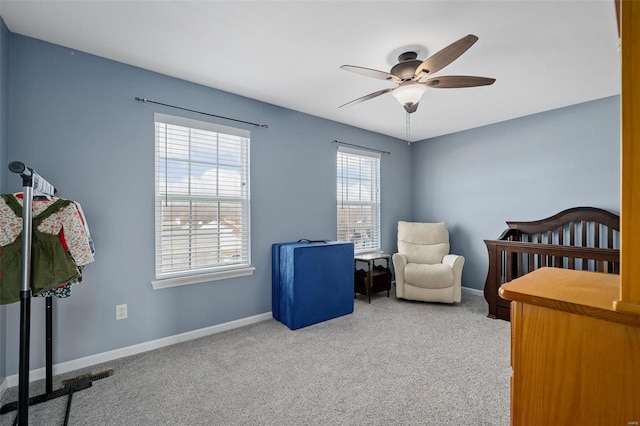 bedroom with light colored carpet and ceiling fan