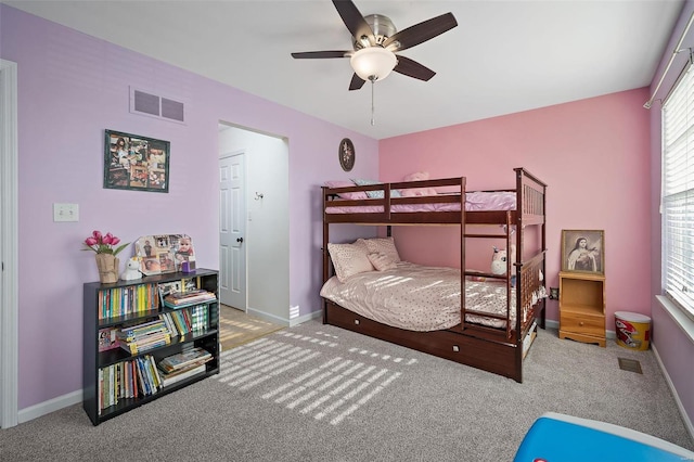 carpeted bedroom with ceiling fan