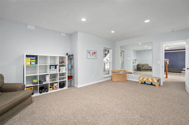 recreation room with carpet flooring