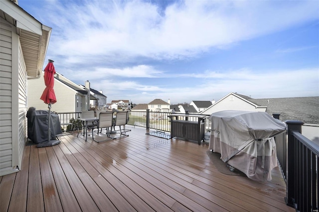 wooden terrace with area for grilling