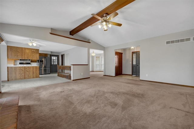 unfurnished living room featuring vaulted ceiling with beams, light carpet, and ceiling fan