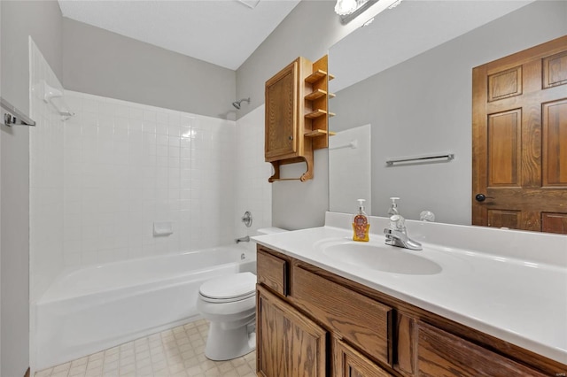 full bathroom featuring tiled shower / bath combo, vanity, and toilet