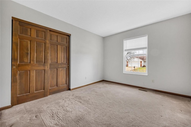 unfurnished bedroom featuring carpet flooring