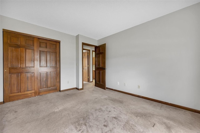 unfurnished bedroom featuring light carpet