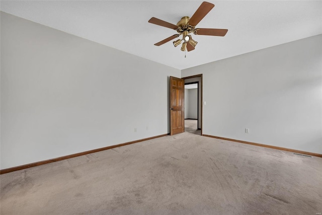 unfurnished room with carpet and ceiling fan