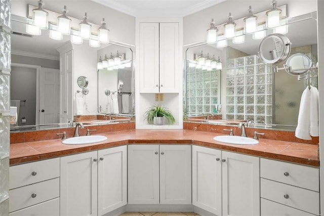 bathroom with crown molding and vanity