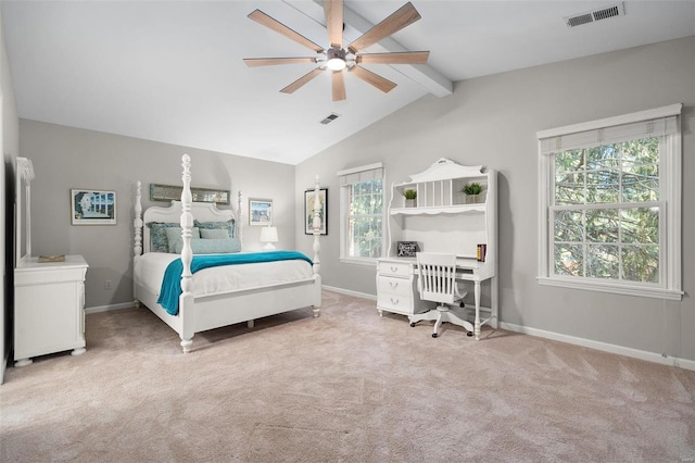 carpeted bedroom with lofted ceiling with beams and ceiling fan