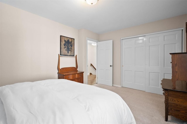 carpeted bedroom with a closet