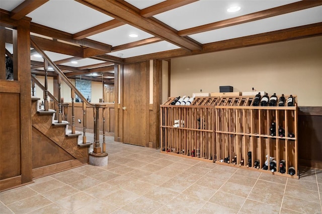 wine cellar featuring beamed ceiling and coffered ceiling