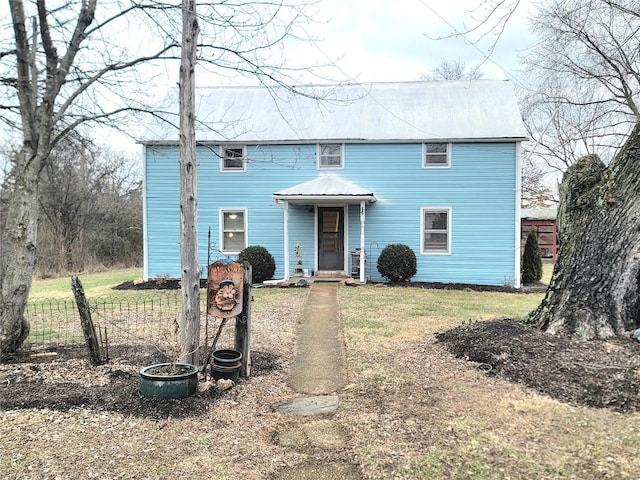 colonial home featuring a front yard