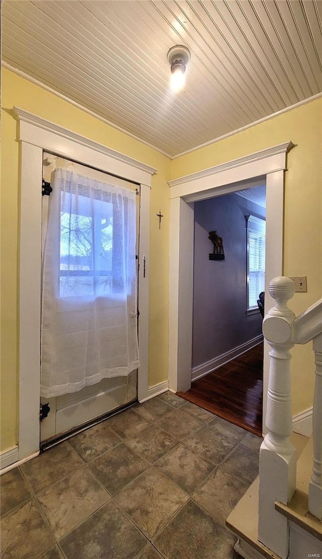 doorway featuring plenty of natural light and wooden ceiling