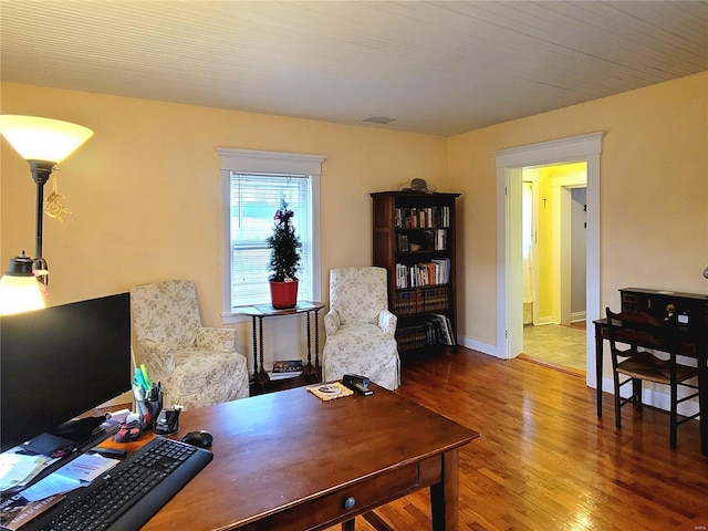 office with hardwood / wood-style flooring