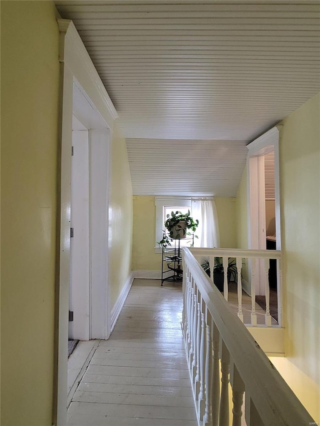 corridor with light hardwood / wood-style flooring