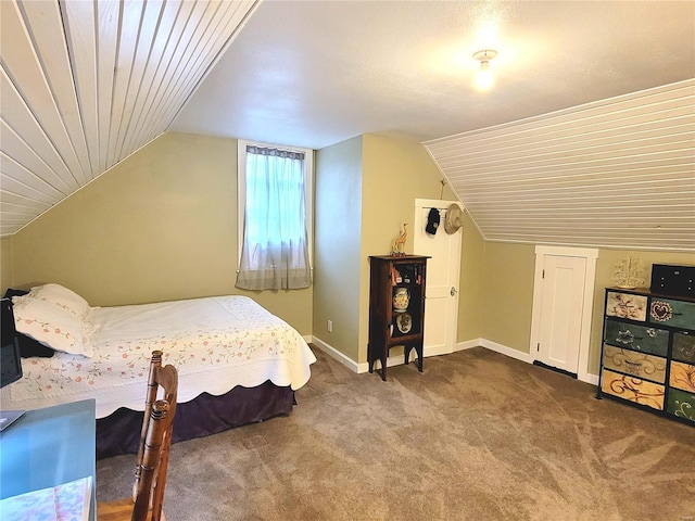 bedroom featuring lofted ceiling, wood ceiling, and carpet flooring