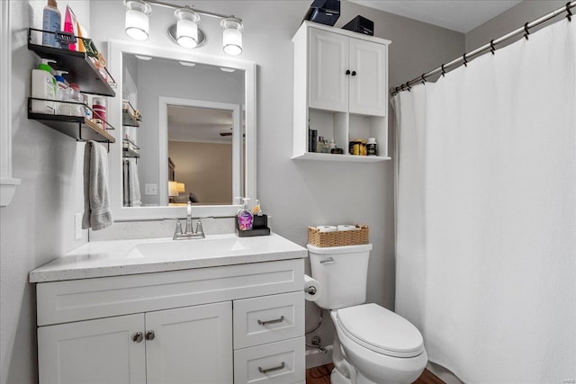 bathroom featuring toilet and vanity