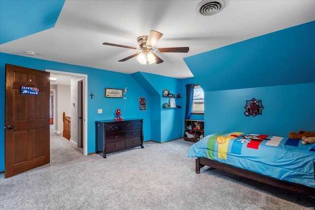 bedroom with ceiling fan, vaulted ceiling, and light carpet