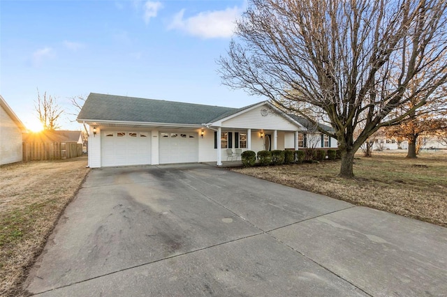 single story home with a garage and a front yard