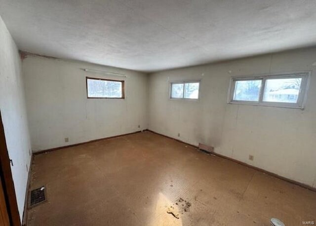 spare room featuring a wealth of natural light