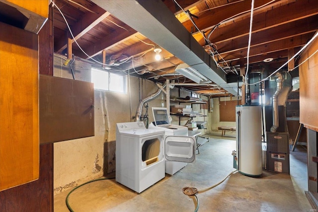 basement with separate washer and dryer and water heater