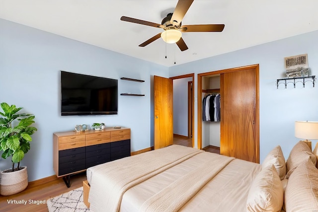 bedroom featuring hardwood / wood-style flooring and ceiling fan