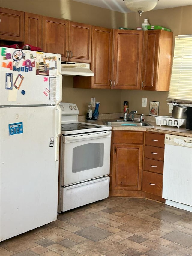 kitchen with white appliances and sink