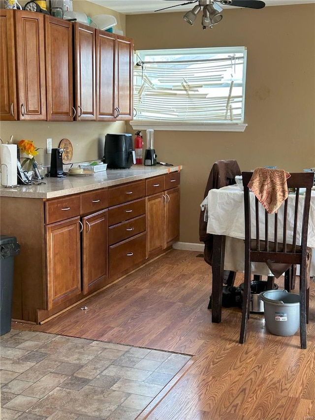 kitchen with dark wood-type flooring and ceiling fan