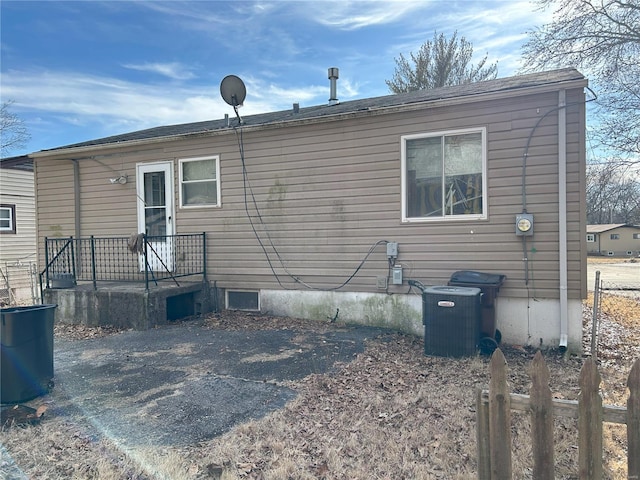 back of property with central AC unit