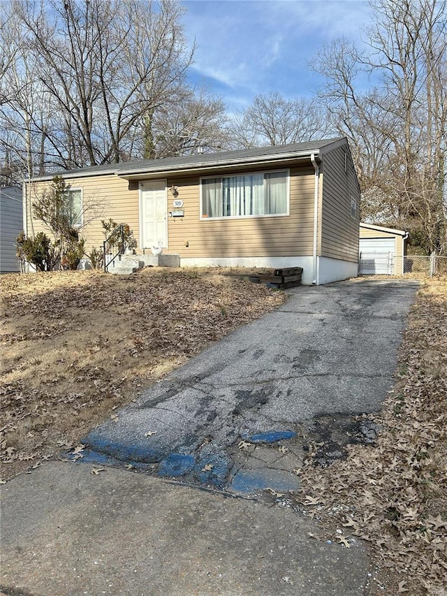 view of front of house with an outbuilding and a garage