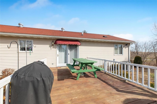 wooden deck with grilling area