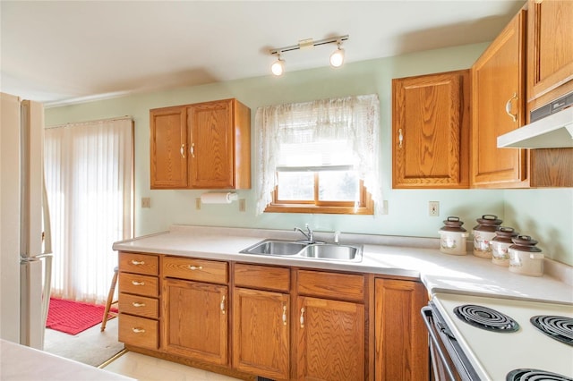 kitchen with sink and white appliances