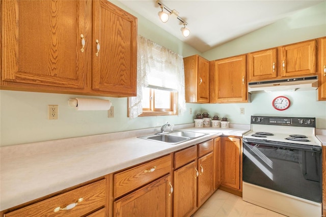 kitchen featuring vaulted ceiling, track lighting, sink, and electric range oven