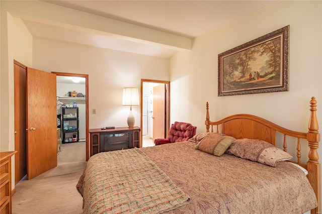 carpeted bedroom featuring beamed ceiling